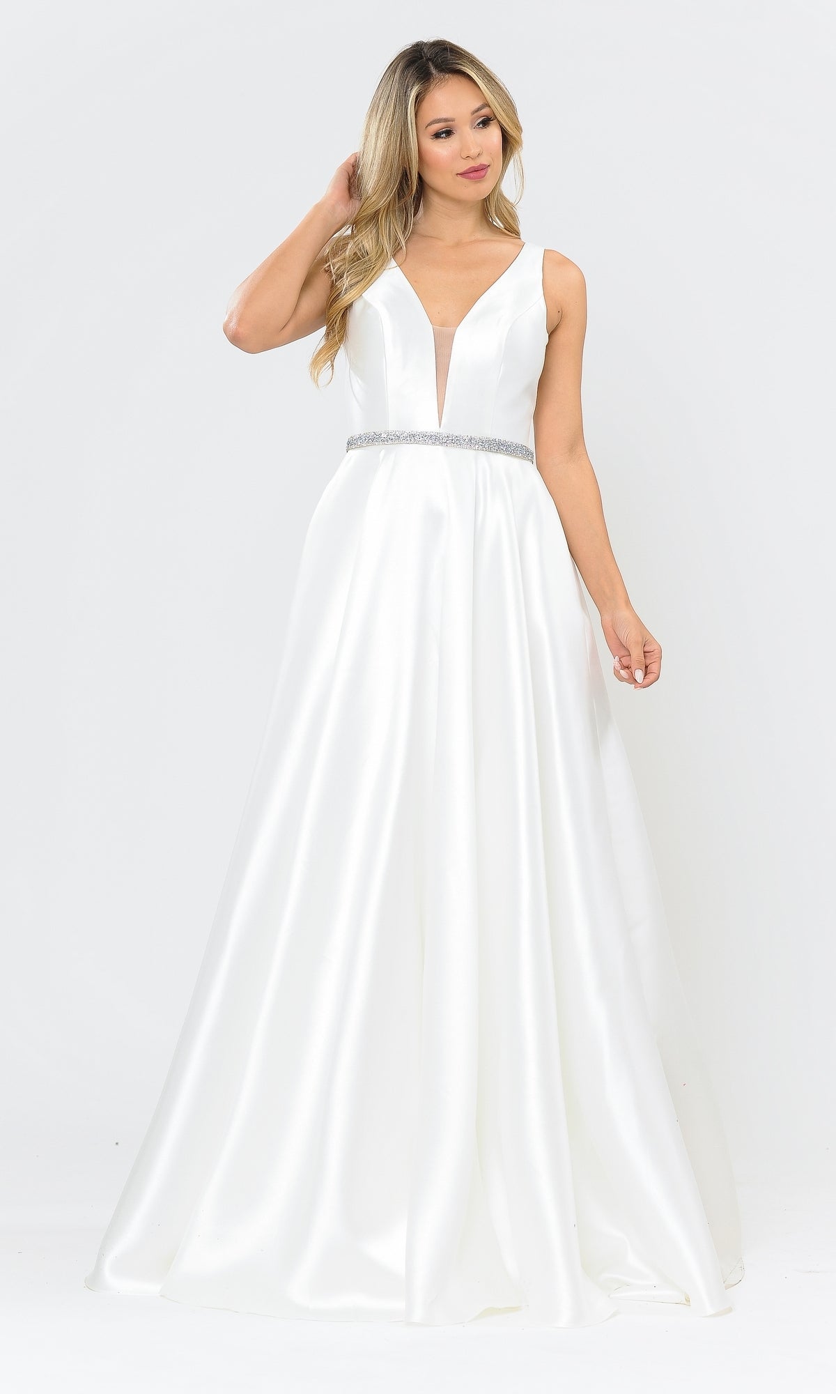 A woman wears the Deep V-Neck Long Mikado A-Line Prom Dress 8682, featuring a white sleeveless design and jeweled belt, standing against a plain white background.
